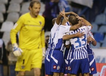 deportivo-corunas-players-celebrate-their-goal-against-malaga-during-their-spanish-first-division-soccer-match-at-riazor-stadium-in-coruna